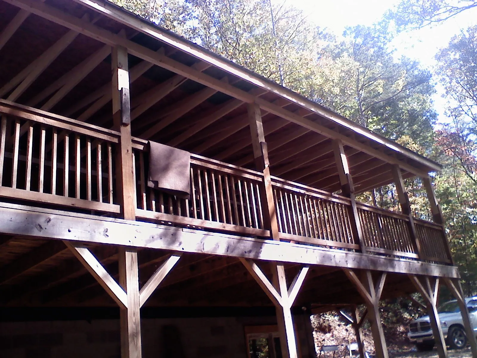 Timber framing under a new elevated porch and deck — Roof Leak Repair in Liberty by Roofing Brothers